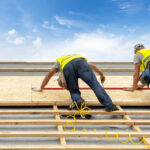 Building construction process of new wooden roof on wood frame house