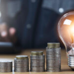 Hand of male holding a light bulb and copy space for accounting,